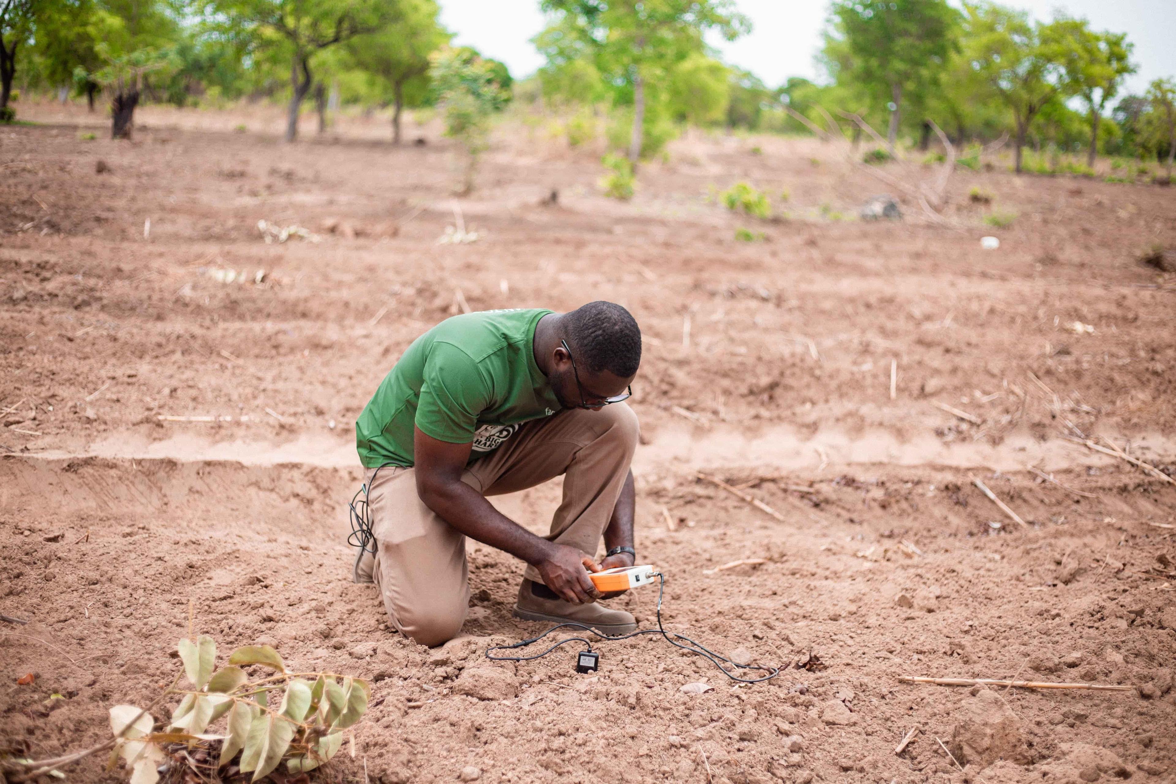 Farmer conducting soil test